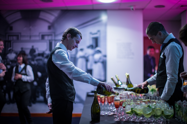 1599 team serving drinks